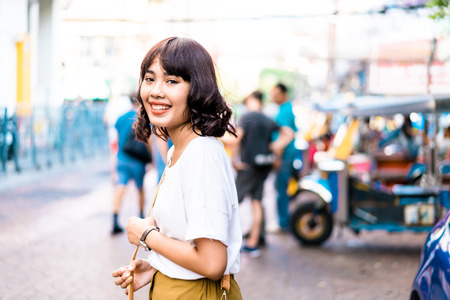 Happy and Beautiful Asian woman traveling at Khao Sarn Road in Thailandの写真素材
