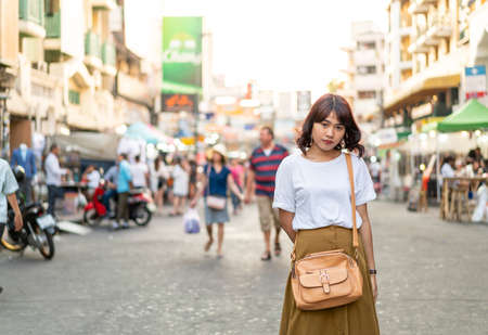 Happy and Beautiful Asian woman traveling at Khao Sarn Road in Thailandの写真素材