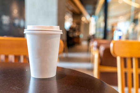 hot coffee paper cup in coffee shop and cafeの写真素材