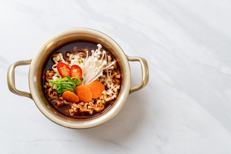 korean instant noodles in golden pot - korean food styleの写真素材