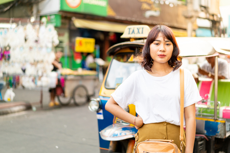 Happy and Beautiful Asian woman traveling at Khao Sarn Road in Thailandの写真素材