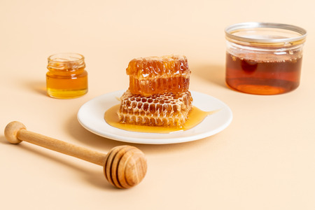 honey and fresh honeycombs with copy spaceの写真素材