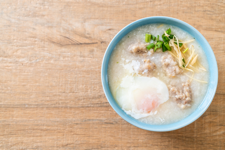congee with minced pork in bowl - Asian breakfast styleの写真素材