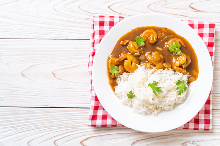Shrimps in curry sauce on topped riceの写真素材