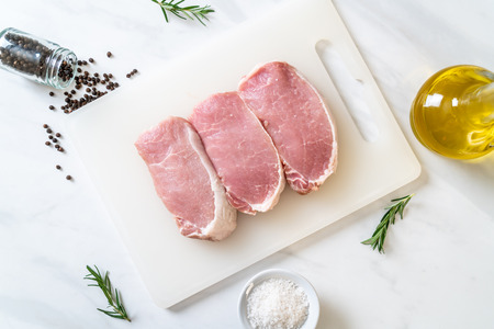 fresh pork raw on cutting boardの写真素材