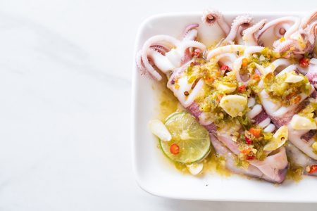 Steamed Squids or Octopus with Spicy Chili and Lemon Lime Sauceの写真素材