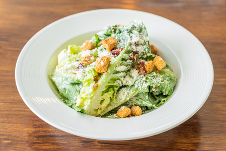 Caesar salad on white plate - Healthy and organic food styleの写真素材