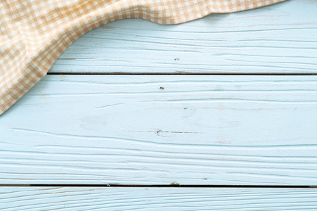 kitchen cloth (napkin) on blue wooden background with copy spaceの写真素材