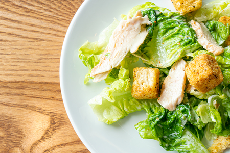 caesar salad with chicken - healthy food styleの写真素材