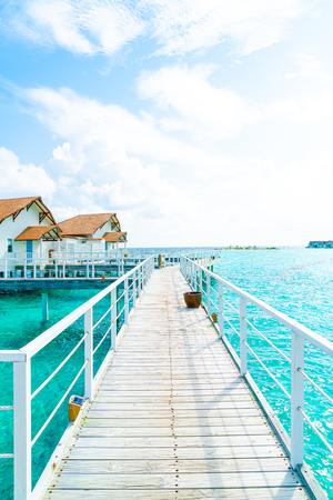 Beautiful tropical Maldives resort hotel and island with beach and sea  - boost up color processing styleの写真素材