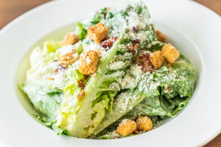 Caesar salad on white plate - Healthy and organic food styleの写真素材