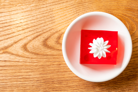 strawberry jelly with white cream on plateの写真素材