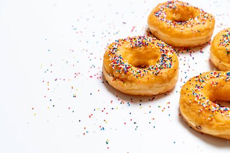 Donut with colorful sprinkles - top viewの写真素材