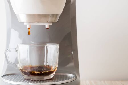 coffee maker machine making coffee on wood backgroundの写真素材