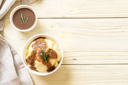 homemade mashed potatoes with gravy sauceの写真素材