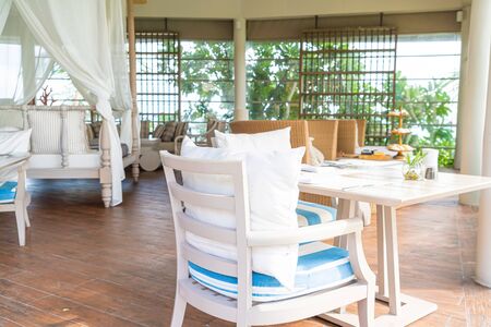 beautiful and comfortable pillow on patio chairの写真素材