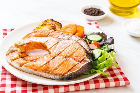 double grilled salmon steak fillet with vegetableの写真素材