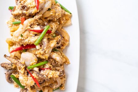Stir-Fried Squid or Octopus with Salted Eggs - Asian seafood styleの写真素材