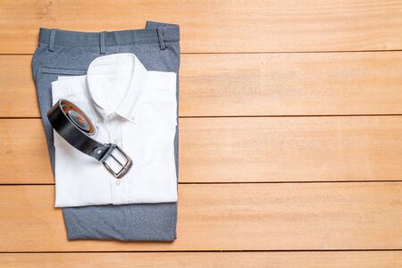 Beautiful casual men fashion and clothes set on wood backgroundの写真素材