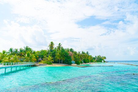 Beautiful tropical Maldives resort hotel and island with beach and sea  - boost up color processing styleの写真素材