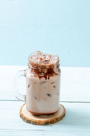 Iced chocolate milkshake drink on wood backgroundの写真素材