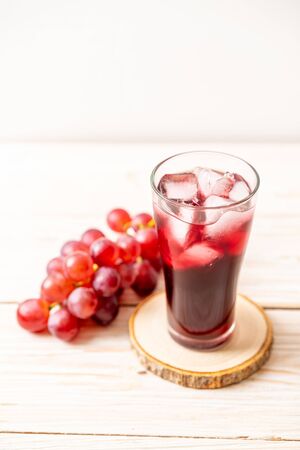 fresh grape juice on wood backgroundの写真素材