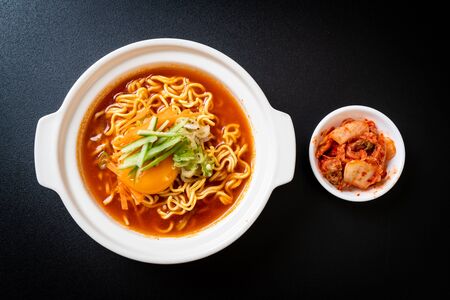 korean spicy instant noodles with egg, vegetable and kimchi - korean food styleの写真素材