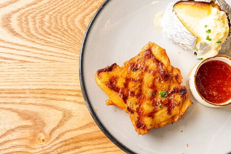 grilled chicken steak with potato on plateの写真素材