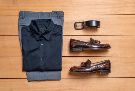 Beautiful casual men fashion and clothes set on wood backgroundの写真素材
