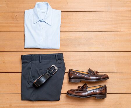Beautiful casual men fashion and clothes set on wood backgroundの写真素材