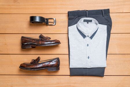 Beautiful casual men fashion and clothes set on wood backgroundの写真素材