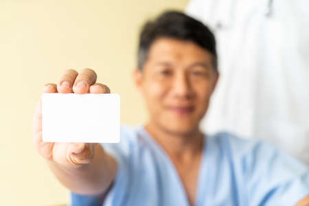 Asian senior patient wheelchair smiling with credit card - silective focus pointの写真素材
