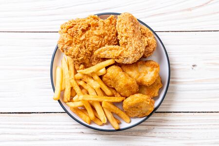 fried chicken with french fries and nuggets meal - junk food and unhealthy foodの写真素材