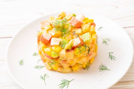 Mixed fruit salad with crab stick (apple, corn, papaya, pineapple)の写真素材