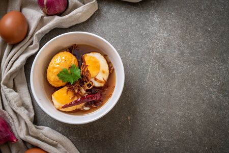 Fried Boiled Egg with Tamarind Sauce or Sweet and Sour Eggsの写真素材