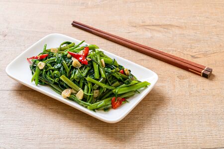 Stir-Fried Chinese Morning Glory or Water Spinach - Asian food styleの写真素材