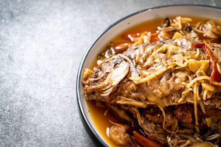 Boiled Carp fish with pickled lettuce - Asian food styleの写真素材