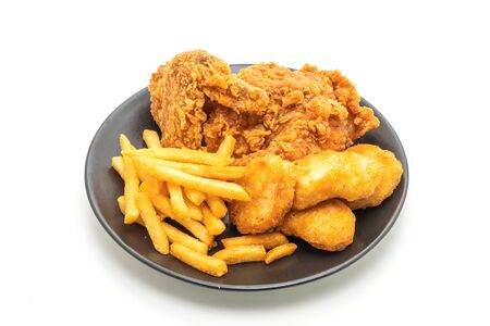 Fried chicken with french fries and nuggets meal (junk food and unhealthy food) isolated on whiteの写真素材