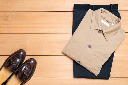 Beautiful casual men fashion and clothes set on wood backgroundの写真素材