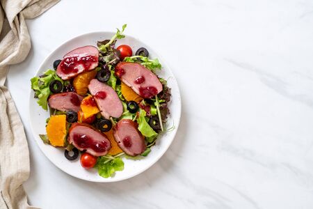 grilled duck breast with vegetable saladの写真素材