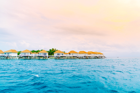 tropical Maldives resort hotel and island with beach and beautiful sky for holiday vacation conceptのeditorial素材