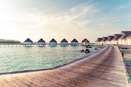 Beautiful tropical Maldives resort hotel and island with beach and sea  - boost up color processing styleのeditorial素材