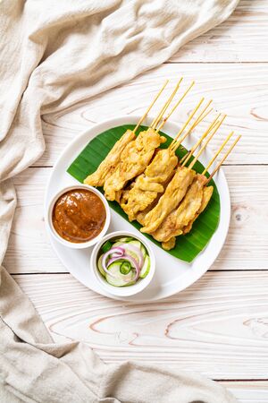 Pork satay - Grilled pork served with peanut sauce or sweet and sour sauce - Asian food styleの写真素材