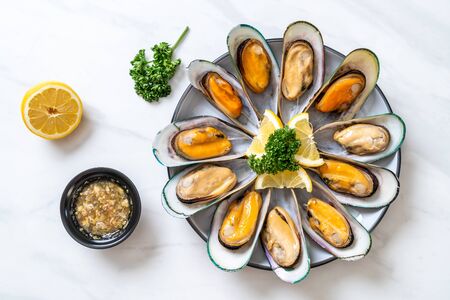 seafood mussels with lemon and parsleyの写真素材