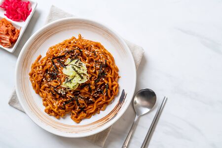 Korean hot and spicy instant noodle with kimchi - korean food styleの写真素材