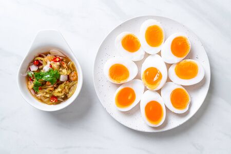 Soft Boiled Eggs Spicy Salad - Healthy food styleの写真素材