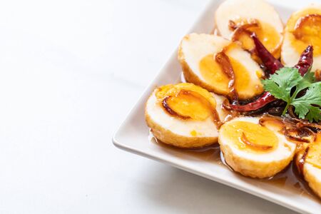 Fried Boiled Egg with Tamarind Sauce or Sweet and Sour Eggsの写真素材