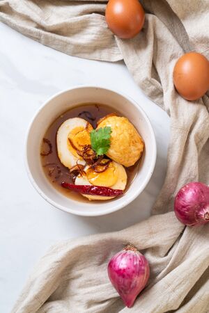 Fried Boiled Egg with Tamarind Sauce or Sweet and Sour Eggsの写真素材
