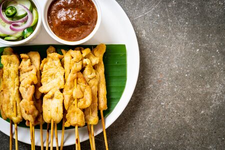 Pork satay - Grilled pork served with peanut sauce or sweet and sour sauce - Asian food styleの写真素材