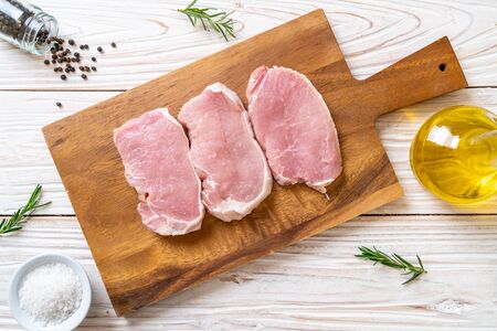 fresh pork raw on cutting boardの写真素材